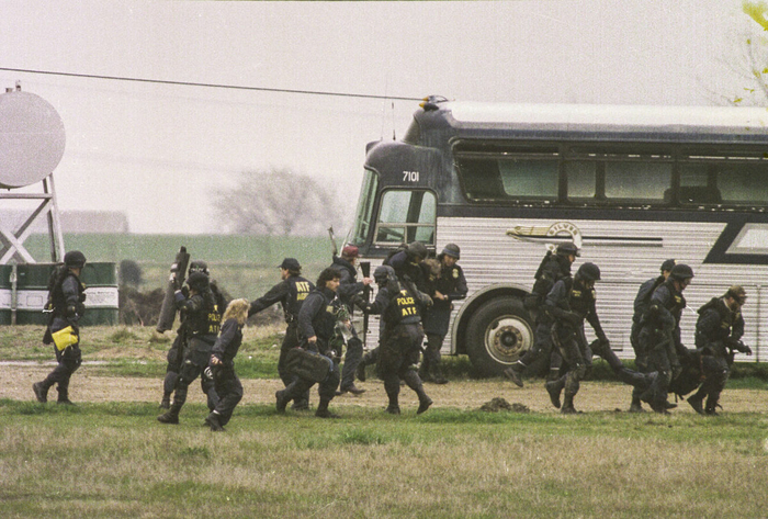 ATF agents help a wounded agent
