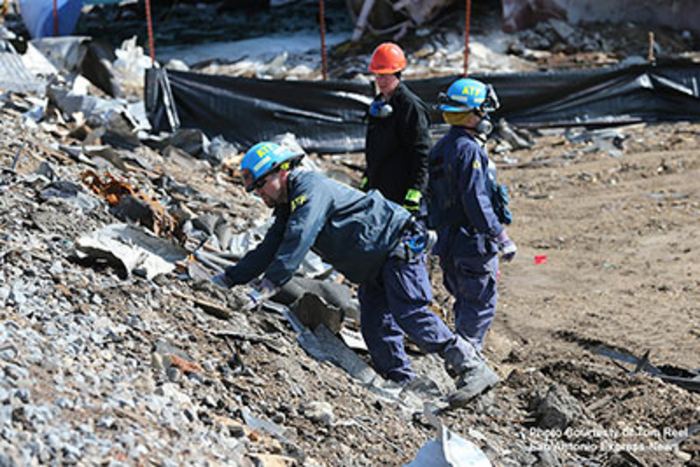 Agents inspecting debris