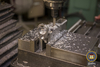Milling material from fire control cavity