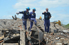 Agent pointing to debris