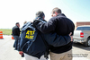 Agents hugging each other