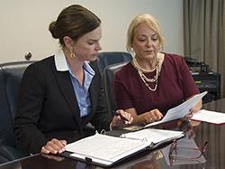 An industry operations investigator conducts an interview in the office.