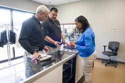 Industry Operations Investigators inspect the firearms inventory at a pawn shop