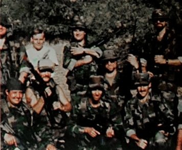 Group of 9 Viper Militia members posing and holding firearms
