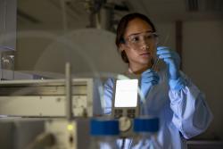 Lab assistant looking at tests results