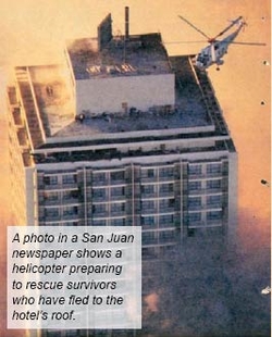 Helicopter preparing to rescue survivors who fled to the hotel roof.
