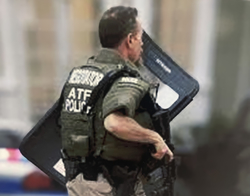 Special agent pictured with a shield