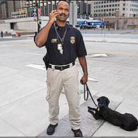 Special Agent Canine Handler George Goodman and K-9 Haiku search for bombs before Major League All-Star Game in Detroit