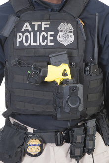 ATF agent's tactical vest with body worn camera on it.