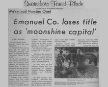 Artículo de noticias de Swainsboro Forest-Blade con titular: ¡No somos el número uno! El Condado de Emanuel pierde el título como Moonshine Capital