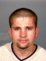 Picture of Ivan Reyes.  A wanted fugitive.