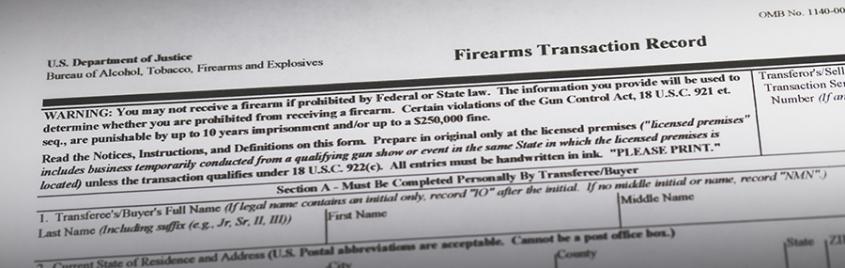 Firearms transaction record form laying on a table