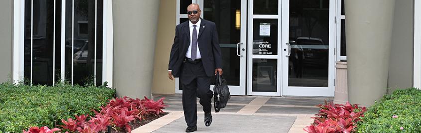 Special Agent in Charge Chris Robinson leaving a building.