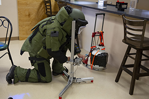 A Raven's Challenge Certified Explosives Specialist diffuses a device