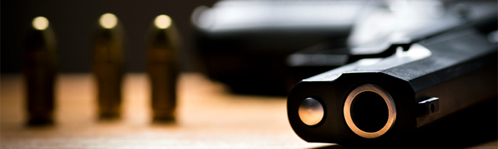 Handgun and bullets on a table