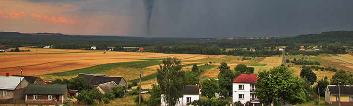 Tornado swirling behind a town