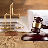 A legal scale and a judge's gavel