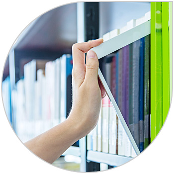 Person grabs a digital reader from a bookshelf