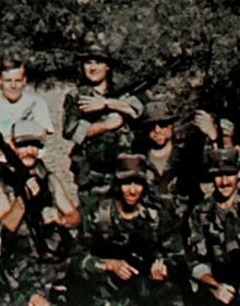 Group of 9 Viper Militia members posing and holding firearms