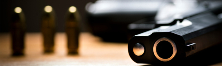 Handgun and bullets on a table