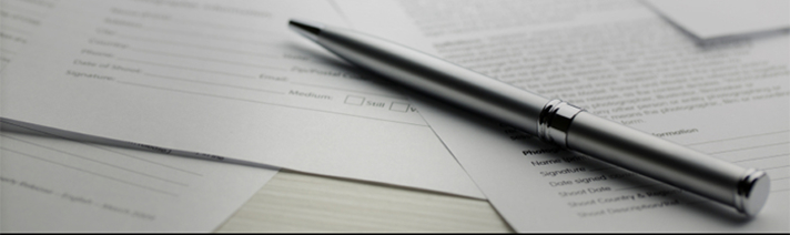 A pen on top of papers