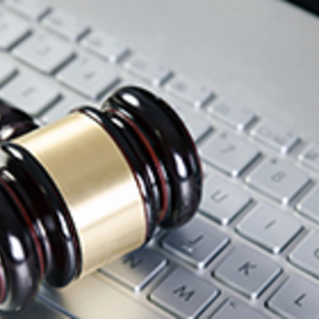 A gavel on a keyboard