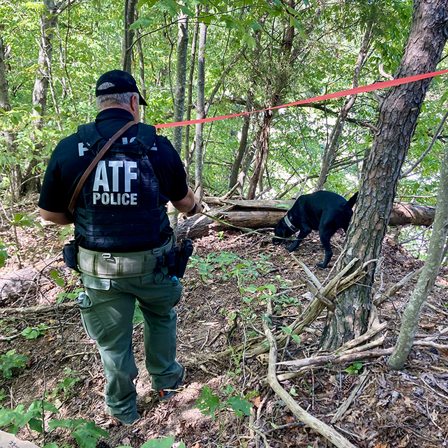 Two agents standing in front of a crime scene