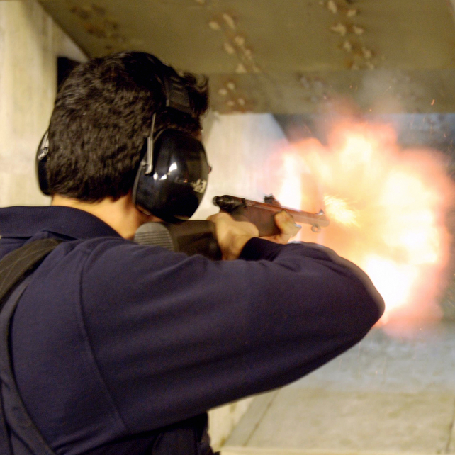 An individual fires a firearm