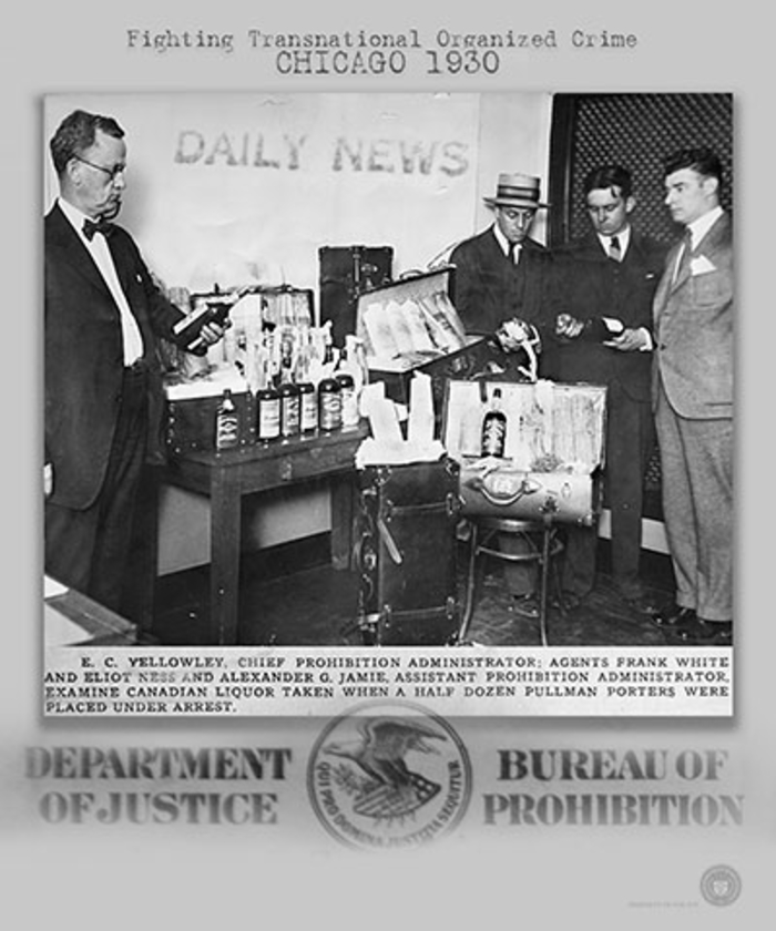 4 Agents standing near evidence. Caption: Fighting organized crime