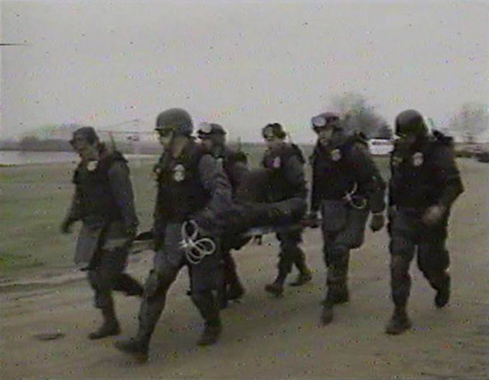 ATF agents carrying wounded person