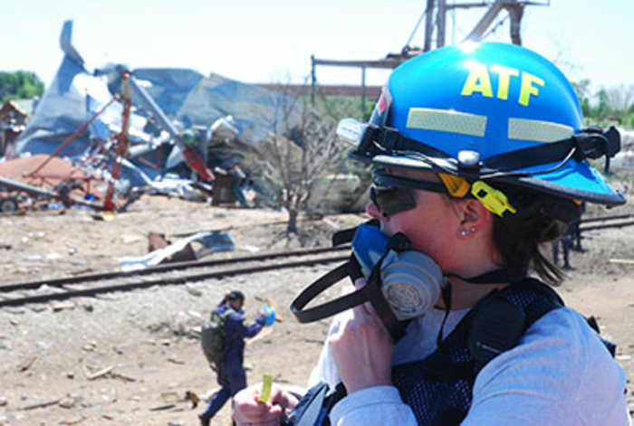 Agent with a mask over her mouth