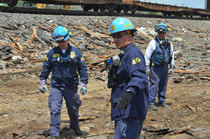 Agent pointing at debris