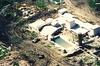 Aerial view of the Mount Carmel compound with smoke coming out of the windows.