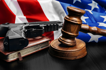 Artwork representation of protecting Second Amendment rights that includes a flag, firearm, bible and gavel.