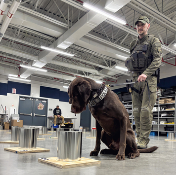 A K-9 and their handler participate in National Odor Recognition Testing