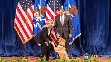 A K-9 team receives an award at the Department of Justice Awards Ceremony